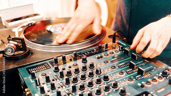 Obraz Outdoor music party. Dj playing on vinyl. Dj's hands and turntable close up