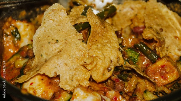 Obraz Close-up of Pecel - Traditional Javanese salad, consisting of mixed vegetables in a peanut sauce dressing, served with omelet.