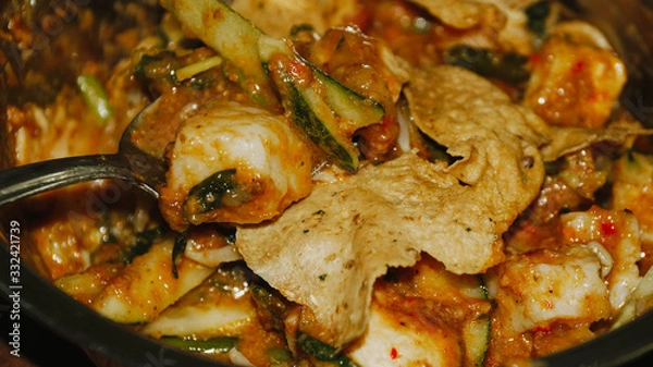 Obraz Close-up of Pecel - Traditional Javanese salad, consisting of mixed vegetables in a peanut sauce dressing, served with omelet.
