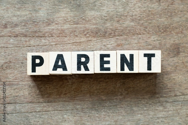 Fototapeta Letter block in word parent on wood background