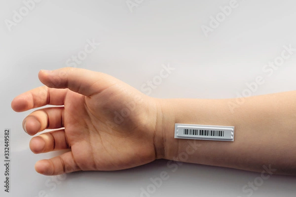 Fototapeta Bar code is on  the child hand. Copy space.  Clone of DNA and human genome. The concept child trafficking, digital concentration camps , electronic cards.