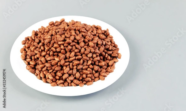 Fototapeta Breakfast with chocolate rice, top view. Space for text