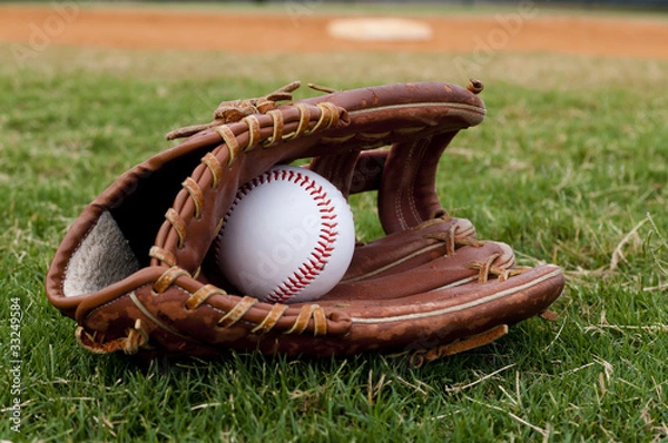 Obraz Baseball in Old Glove on Field