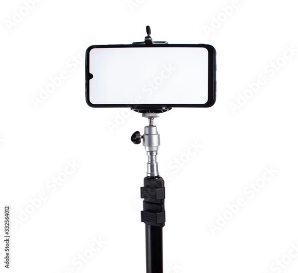 Obraz Smartphone mounted on a tripod in a horizontal position on a white isolated background.