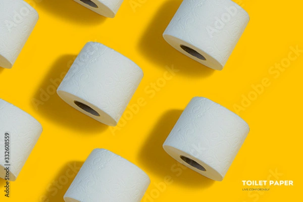 Obraz Toilet paper pattern on top on yellow background for banner or advertisement.