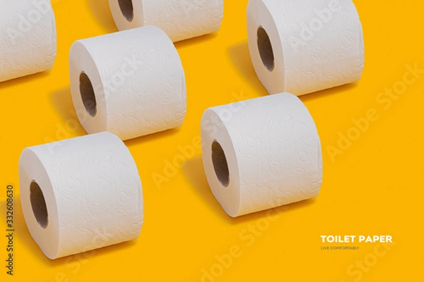 Obraz Toilet paper pattern on top on yellow background for banner or advertisement.