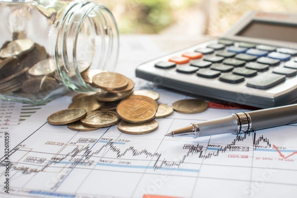 Fototapeta The pen is placed on a bill or payroll account with numbers placed on the table, office concept, tax calculation office, financial office and inspection concept.