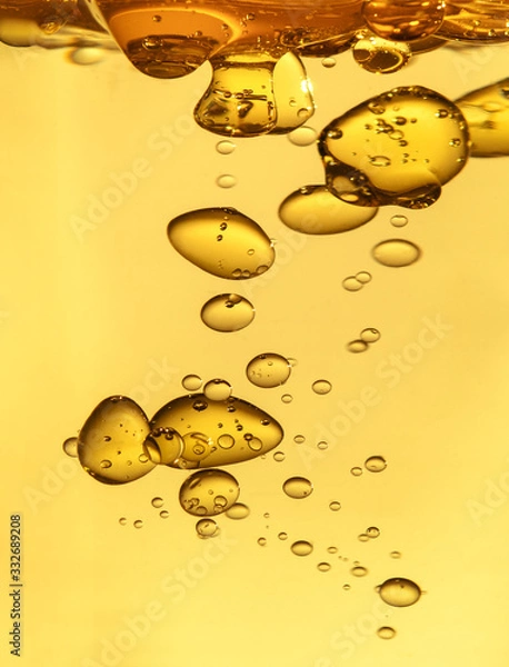 Obraz golden yellow bubble oil droplet, abstract background