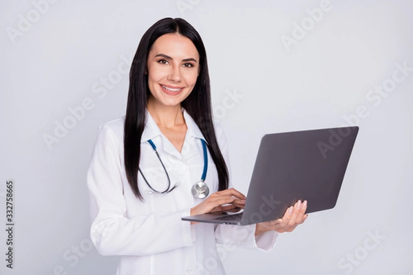 Fototapeta Photo of professional doc lady working with modern technology notebook laptop writing notes patient prescription wear stethoscope white lab coat isolated grey color background