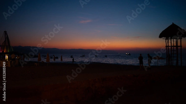 Obraz Deep Red and Blue Sunset on the Beach in Puerto Vallarta Mexico