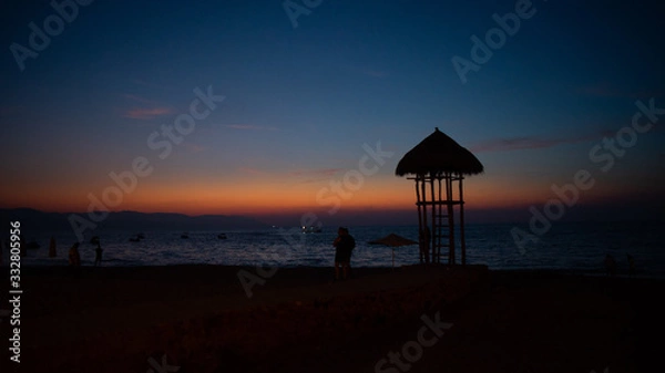 Obraz Deep Red and Blue Sunset on the Beach in Puerto Vallarta Mexico