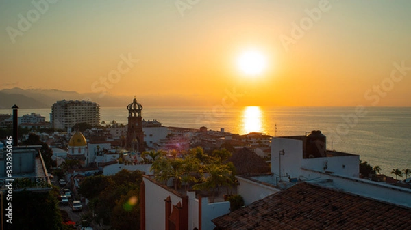 Obraz Amazing Orange Sunset Over Blue Ocean on a Rooftop view of Old Town in Puerto Vallarta Mexico