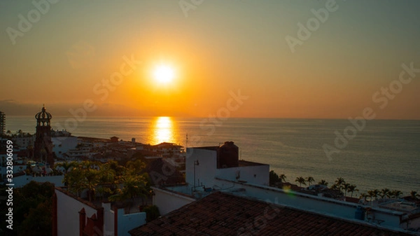 Obraz Amazing Orange Sunset Over Blue Ocean on a Rooftop view of Old Town in Puerto Vallarta MexicoAmazing Orange Sunset Over Blue Ocean on a Rooftop view of Old Town in Puerto Vallarta Mexico