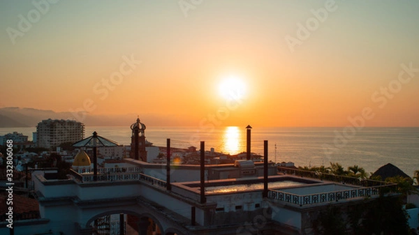 Obraz Amazing Orange Sunset Over Blue Ocean on a Rooftop view of Old Town in Puerto Vallarta Mexico