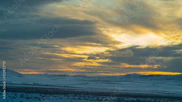 Obraz Cloudy sunset over the mountains