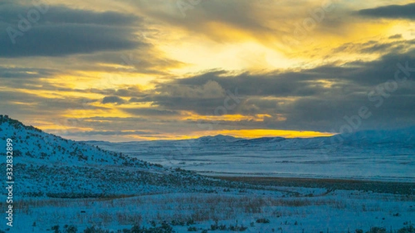 Obraz Cloudy sunset over the mountains