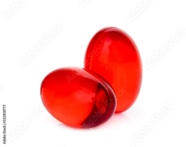 Obraz two red soft gel capsule isolated on white background