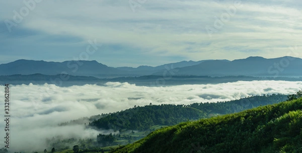 Obraz Remarkable sunrise Sea of clouds above Blangkejeren town but below impressive Bukit Barisan mountain range seen from Kedah, Banda Aceh, Sumatra while wild camping on a hill near Leuser ecosystem