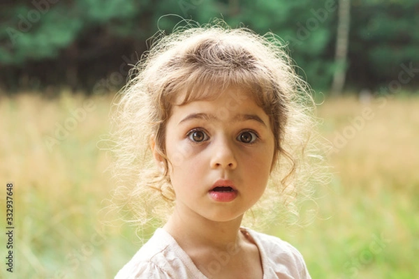 Obraz Close up Portrait of beautiful little Girl  surprised with something at summer day