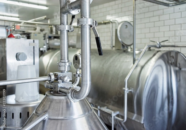 Obraz Liquid storage tank and pipe at dairy in France