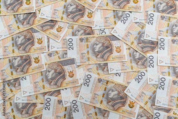 Fototapeta Background made from the front side of the Polish 200 PLN banknote, background for finance and economics.