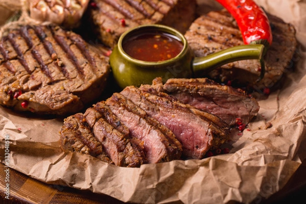 Obraz grilled meat medallions grilled vegetables dark background craft bbq