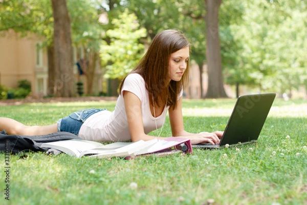 Obraz A pretty young student with study materials