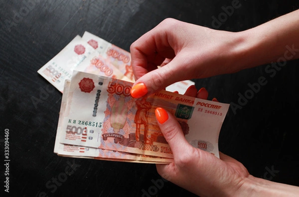 Obraz women's hands consider money large bills