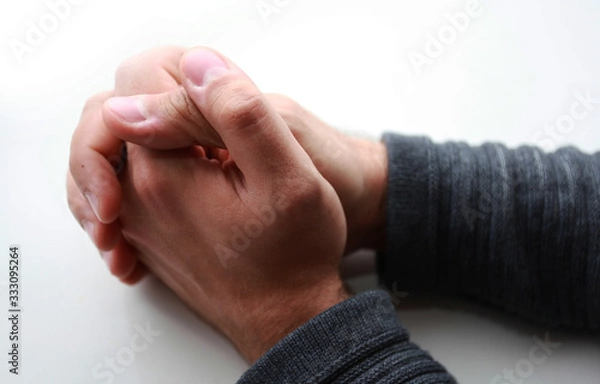 Obraz male hands folded on the table