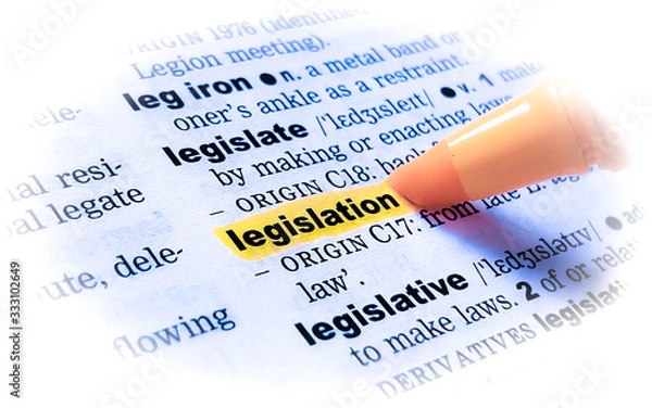 Fototapeta A close up of the word: LEGISLATION in a dictionary, highlighted in yellow and showing part of its definition.	
