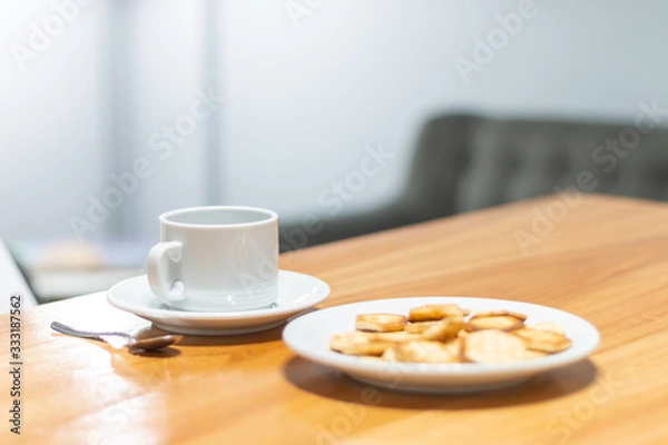 Obraz Coffee cup and seet things for breakfast