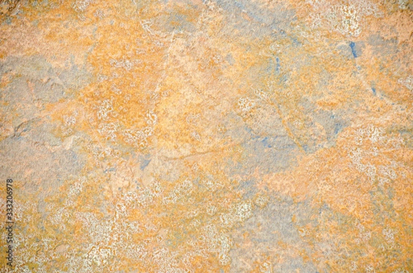 Fototapeta gray wall of old house closeup. White and yellow  peeling plaster. Cracks on the surface of building or fence. City building concept. Copy space. Place for text. Selective focus image.