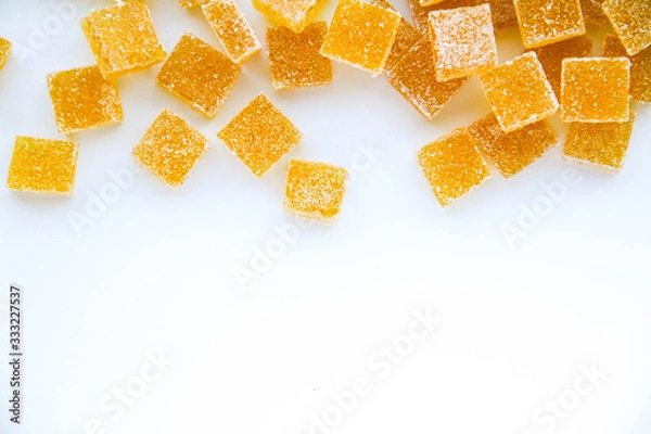 Obraz Pineapple, lemon, vanilla pate de fruit (jelly, marmalade, fruit candy) covered with sugar. White background, top view. There is a copy space for your text.