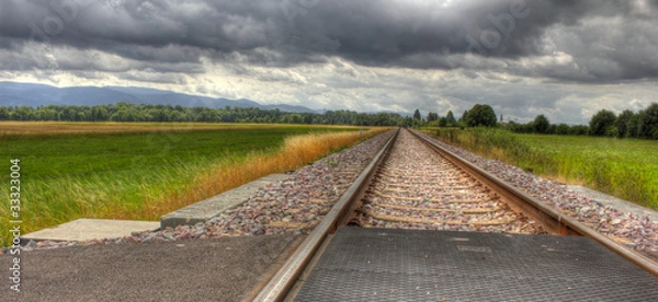 Obraz Railroad under dramatic sky