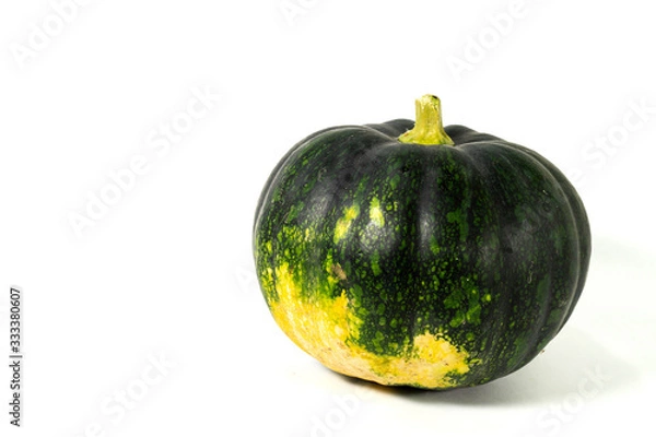 Fototapeta A green natural fresh Indian pumpkin is isolated on white background with blank text