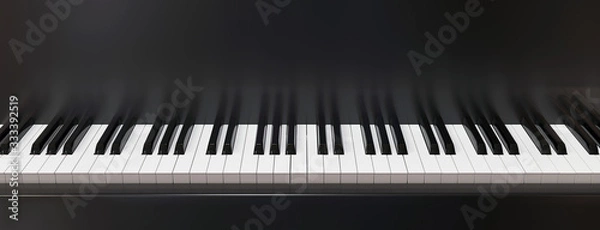 Fototapeta ivories and fragment of the case of a black piano in horizontal photography. 