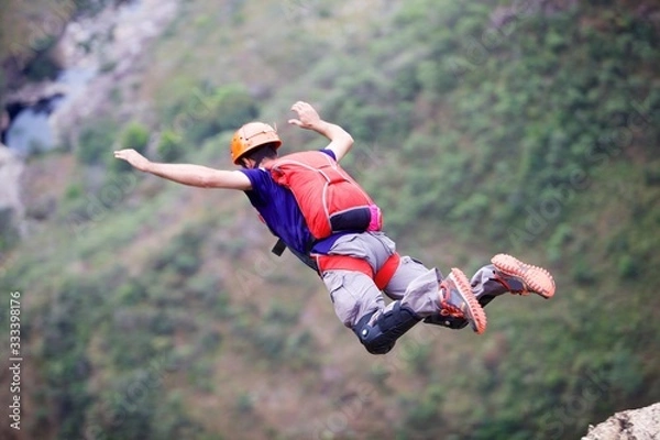 Obraz Man B.A.S.E jumping in the air