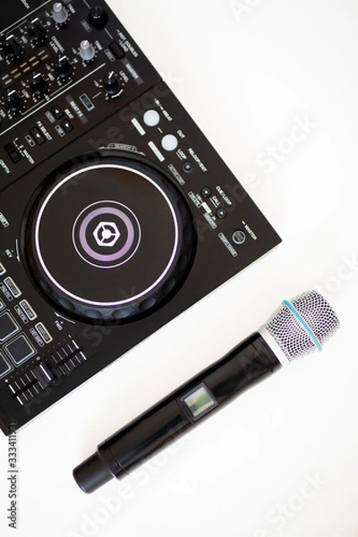 Fototapeta  microphone and dj controller on a white background