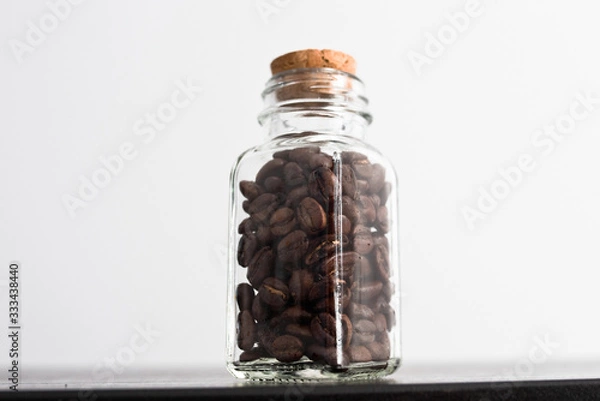 Obraz Coffee beans in a transparent jar