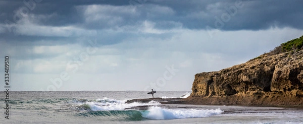 Fototapeta surfer contemplating the ocean