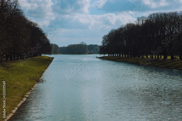 Fototapeta View of a river running into a lake