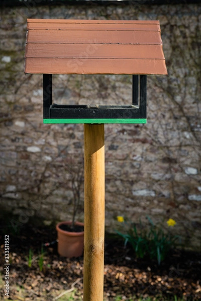 Obraz Rustic birdhouse in a garden
