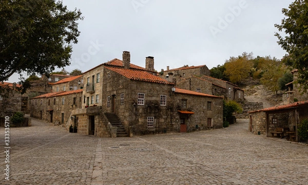 Fototapeta Historic village of Sortelha on a very cloudy day. It is one of historic villages of Portugal, located in Guarda district