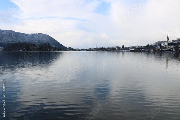 Obraz Lakeside view with distant town 