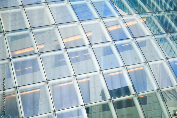 Fototapeta Spider glazing system, Curtain wall in curve, Frame less glass facades modern office building, tempered laminated glasses wall. curtain wall. Abstract concept for architecture background.
