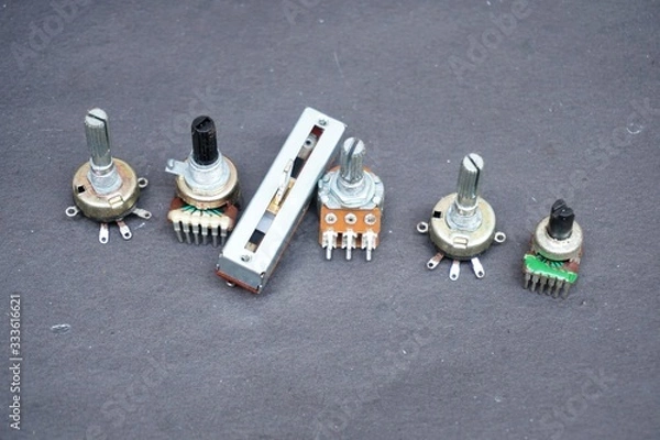 Fototapeta electronic component called a potentiometer. A potentiometer is a three-terminal resistor with a sliding connection that forms an adjustable voltage divider.