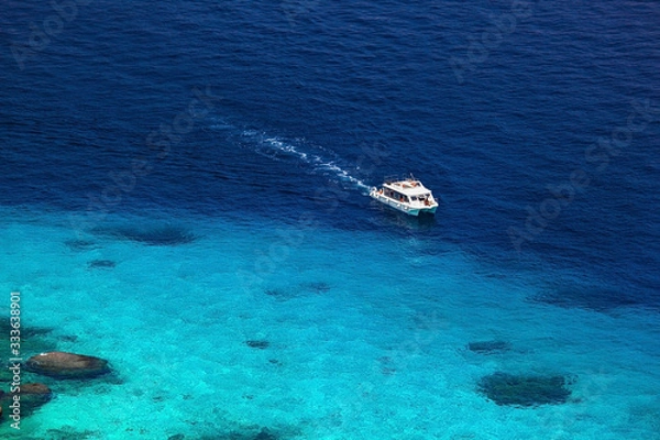 Fototapeta one motorboat in beautiful blue lagoon of Similan islands