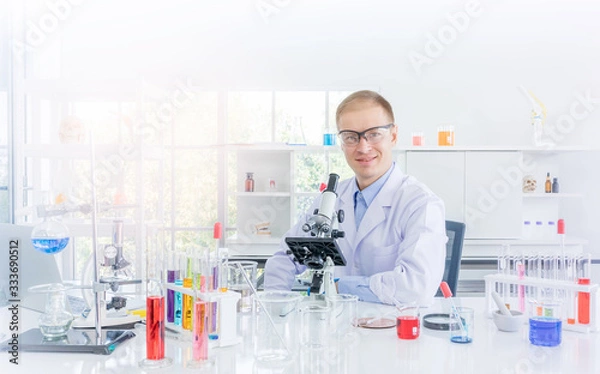 Fototapeta Scientist working or research for some confidential in chemical laboratory
