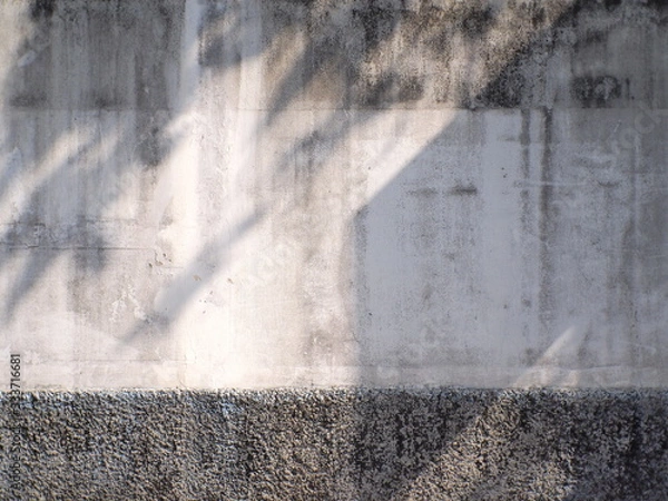 Fototapeta old plaster brick wall with shading 