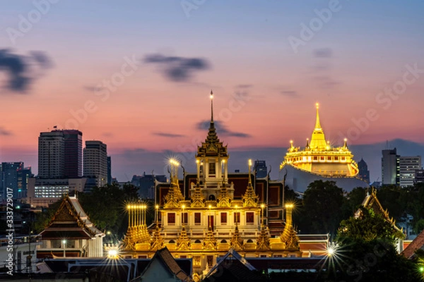 Obraz Golden Metal Castle at Wat Ratchanadda (Loha Prasat) and Gloden Mount at Wat Sraket Rajavaravihara at sunset in Bangkok Thailand. The both famous landmark temple and pagoda in Bangkok Thailand.